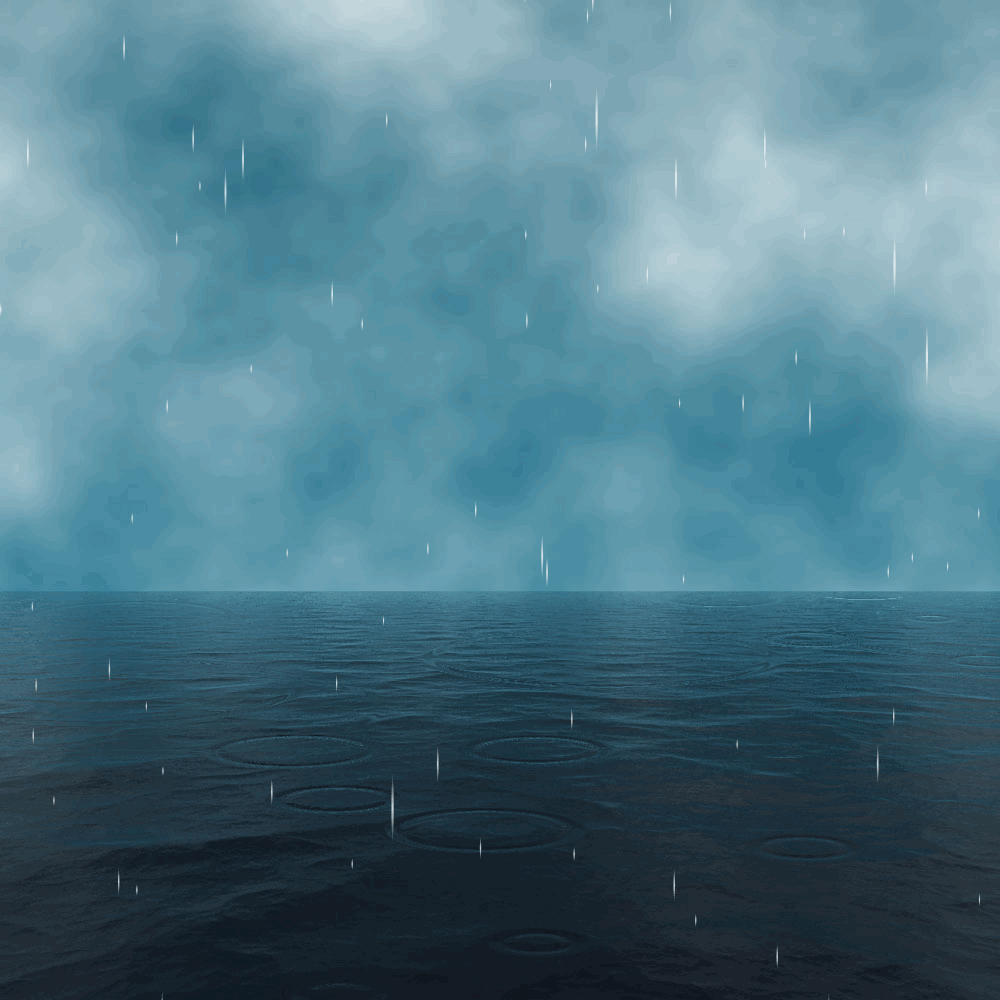 Rain falling on ocean with ripples